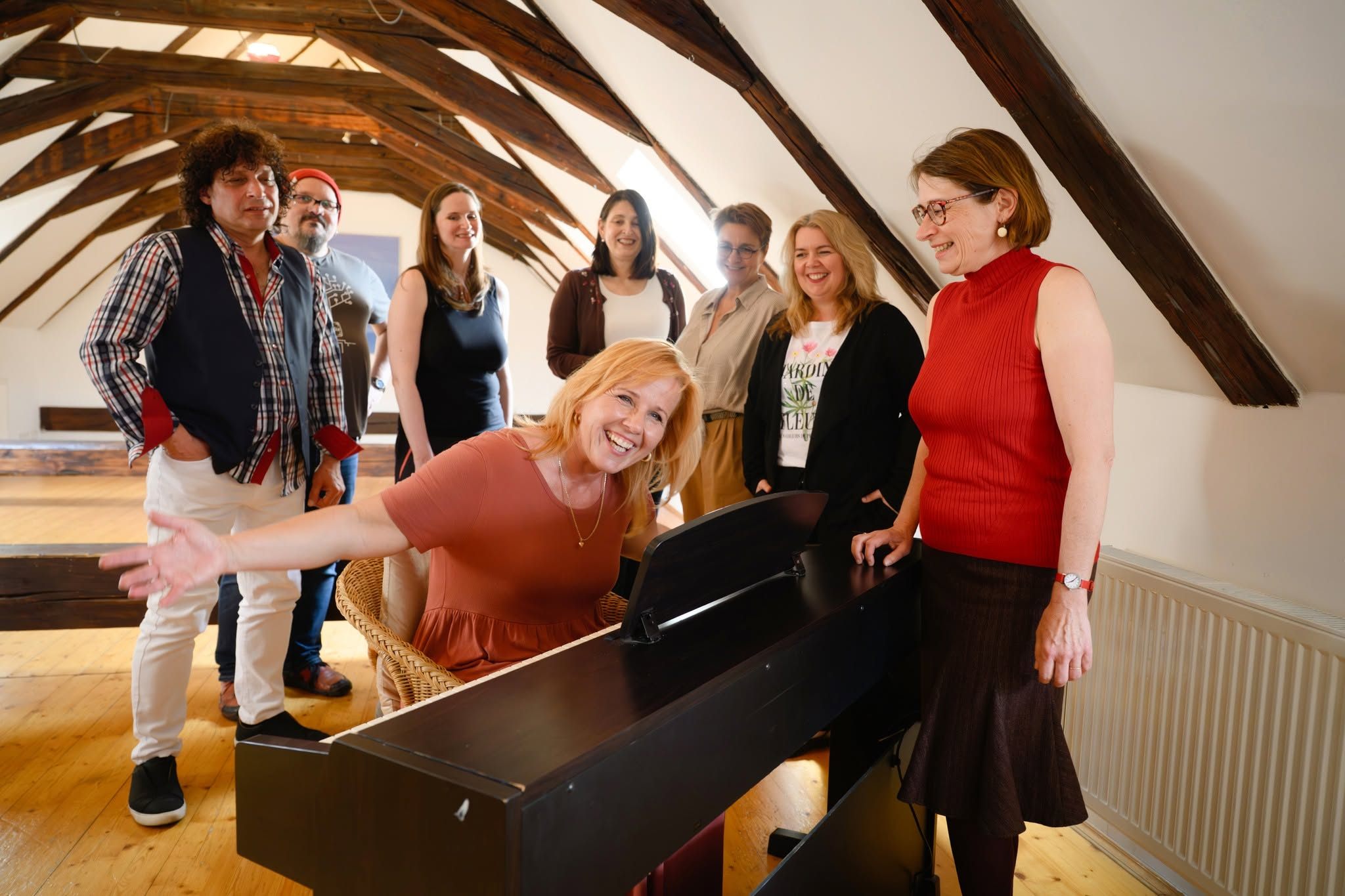 Markéta Amerighi at work at the piano with her colleagues